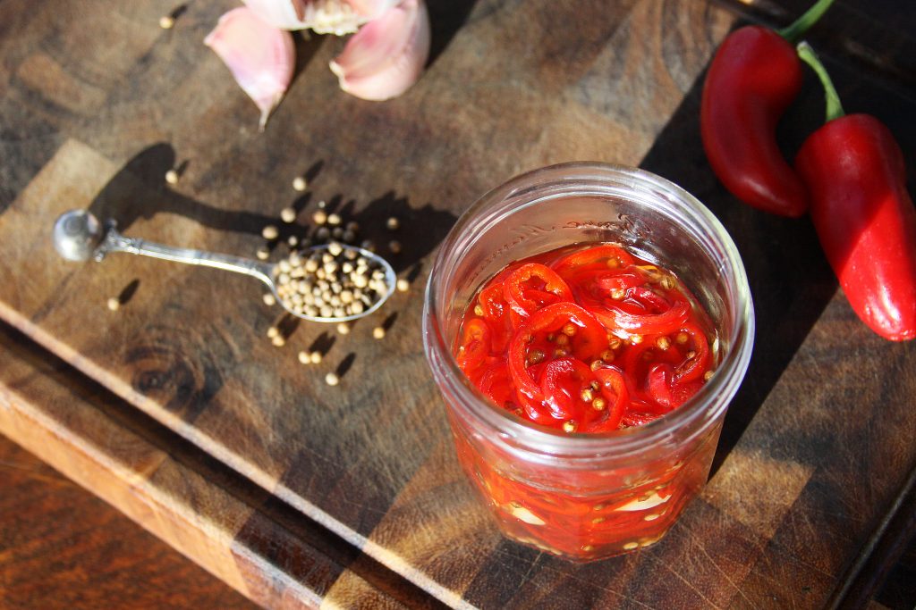 Pickled red chillies and the ingredients 